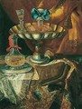 Still life of a wine glass and bottle in a parcel gilt tazza together with a glass decanter on a pewter dish upon a draped tabletop - Maximilian Pfeiler