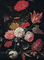 A Still Life Of Tulips, Roses, A Peony, An Iris, Several Varieties Of Poppy, Daisies, A Snowball, Convolvulus, Cow-parsley, Ears Of Corn In A Glass Vase On A Stone Ledge - Abraham Mignon