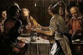 Interior with various figures at a meal by candlelight - (after) Michaelangelo Merisi Da Caravaggio