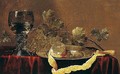 A Still Life Of A Peeled Lemon On A Pewter Dish, Grapes, And A Roemer, All On A Table Draped With A Red Cloth - Abraham Susenier