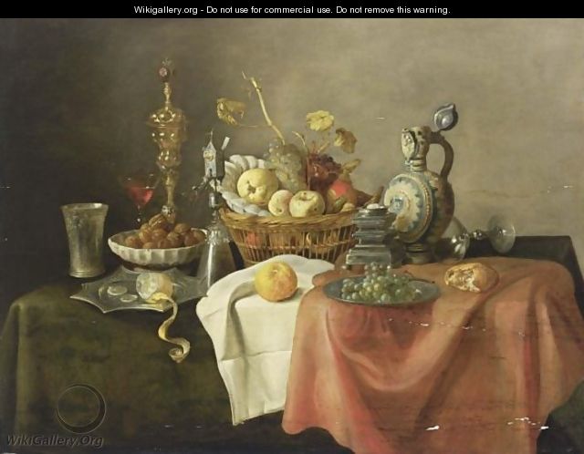 A Sumptuous Still Life With A Silver-Gilt Beaker, A Lemon On A Silver-Gilt Pointed Dish, Walnuts In A Porcelain Bowl, A Silver Gilt Cup With Cover, A Silver-Gilt Mill Glass, A Quince, An Apple, A Peach, Grapes, And Oranges In A Basket - Cornelis Mahu