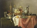 A Sumptuous Still Life With A Silver-Gilt Beaker, A Lemon On A Silver-Gilt Pointed Dish, Walnuts In A Porcelain Bowl, A Silver Gilt Cup With Cover, A Silver-Gilt Mill Glass, A Quince, An Apple, A Peach, Grapes, And Oranges In A Basket - Cornelis Mahu
