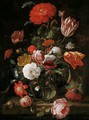 A Still Life Of Tulips, Roses, Blackberries, And Other Flowers In A Glass Vase, On A Stone Ledge - Hendrick Schoock