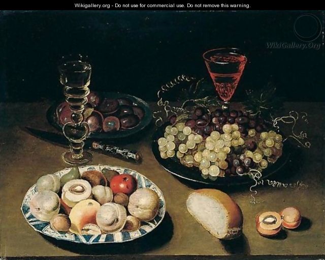 Still Life Of Peaches, Figs, Apples And Walnuts In A Blue And White Porcelain Bowl, Together With Grapes And Plums In Pewter Dishes, Wine Glasses, Bread And A Knife, All Arranged Upon A Table Top - Osias, the Elder Beert
