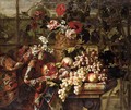 Still Life Of Various Flowers In A Bronze Urn, Together With Pomegranates, Grapes, Pears And Plums On A Marble Table Draped With A Carpet - Jean Baptiste Belin de Fontenay