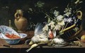 A Still Life Of A Basket Of Grapes, Birds, Including A Partridge, Snipe, Sparrow And Finch, Two Blue-And-White Wan-Li Porcelain Bowls With Langoustines, A Knife, Two Wine Glasses, A Roemer, Stoneware Ewer And A Parcel Gilt Salt Cellar Upon A Stone Ledge - Frans Snyders