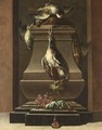 A Hunting Still Life With A Pigeon, A Partridge, A Woodcock And Other Birds Draped On A Stone Pedestal - German School