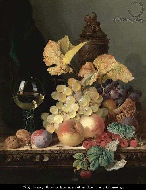 Still Life With Peaches, Plums, Grapes And Walnuts On A Carved Table With A Wine Glass - Edward Ladell