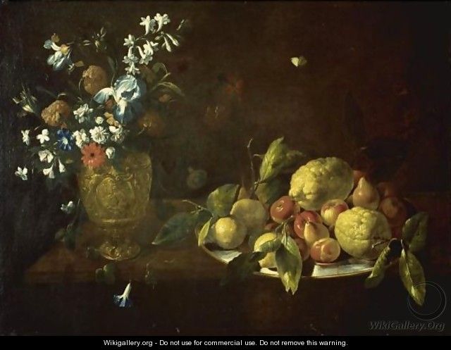 Still Life With Fruit Piled High On A Plate Beside A Bronze Urn Filled With Flowers - Giovanni Stanchi