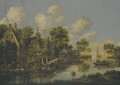 A River Landscape With Figures Unloading Their Boats Beside A Busy Village - Thomas Heeremans
