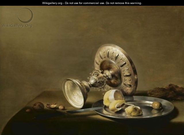 A Still Life With An Overturned Silver Tazza, A Silver Plate With A Partly Peeled Lemon And An Olive, With Walnuts And Hazelnuts - Pieter Claesz.