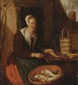 A Kitchenmaid Preparing Carrots - Gabriel Metsu