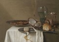 A Still Life With A Half-Peeled Lemon On A Pewter Dish, A Dried Fish With Capers - Maerten Boelema De Stomme