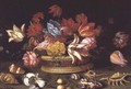 A Basket of Flowers with Shells on a Ledge - Balthasar Van Der Ast
